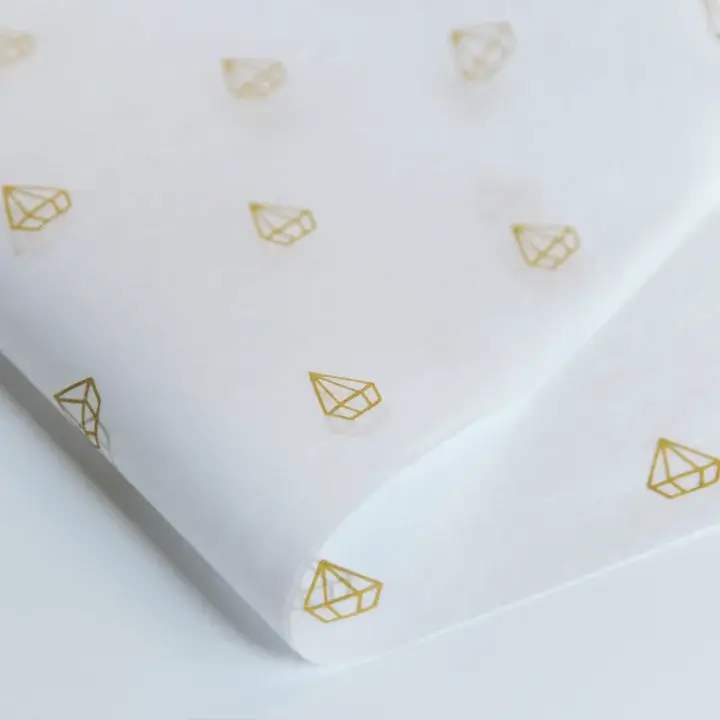 Food-safe greaseproof tissue paper sheets perfectly sized for wrapping donuts, cookies, and bread