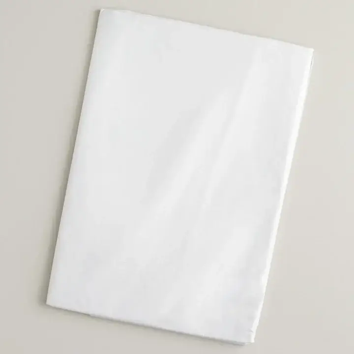 Crisp white acid-free tissue paper sheets used to safely wrap delicate clothing and accessories